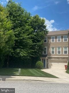 1614 Livingston Dr, Bel Air, MD 21015 - view of front of property with an attached garage, concrete driveway, and a front lawn