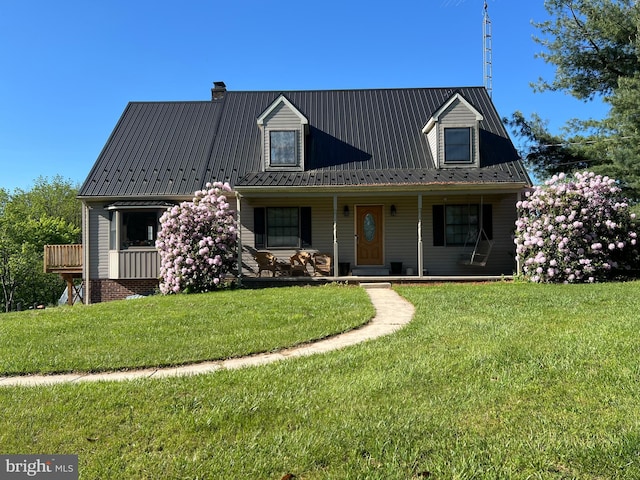 6535 Dumeny Rd, Greencastle, PA 17225 - view of front of home featuring a porch, a front lawn, a metal roof, and a chimney