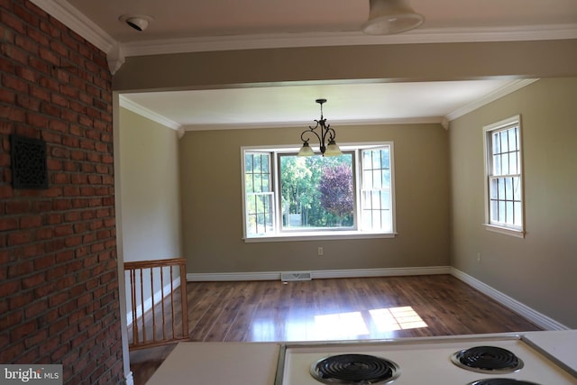 6535 Dumeny Rd, Greencastle, PA 17225 - unfurnished dining area with healthy amount of natural light, wood finished floors, and crown molding