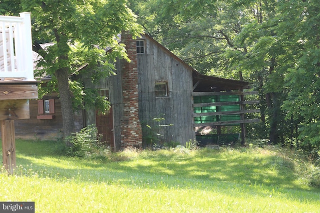 6535 Dumeny Rd, Greencastle, PA 17225 - view of home's exterior with a chimney and an outbuilding
