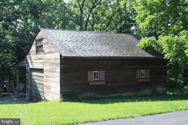 6535 Dumeny Rd, Greencastle, PA 17225 - view of property exterior with roof with shingles, an outdoor structure, a lawn, and a detached garage