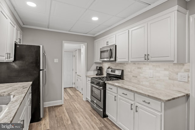 21 Creek Rd, Delran, NJ 08075 - kitchen with appliances with stainless steel finishes, white cabinetry, decorative backsplash, recessed lighting, and light wood-style flooring