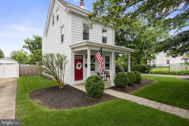 21 Creek Rd, Delran, NJ 08075 - view of front facade with covered porch, a chimney, and an outdoor structure