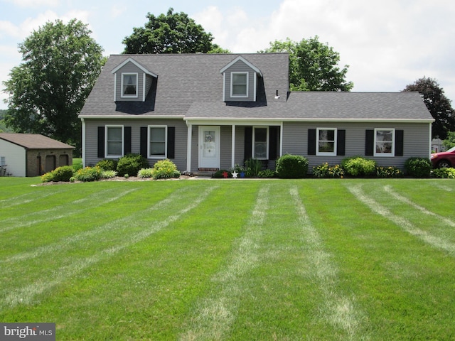 2515 Washington Dr, Gilbertsville, PA 19525 - cape cod house featuring a front yard and roof with shingles