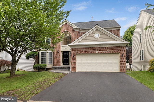 21411 Emerald Dr, Germantown, MD 20876 - traditional-style home featuring asphalt driveway, a front yard, brick siding, and a garage
