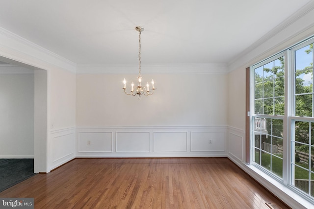 21411 Emerald Dr, Germantown, MD 20876 - unfurnished room with a chandelier, ornamental molding, wood finished floors, and wainscoting