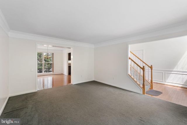 21411 Emerald Dr, Germantown, MD 20876 - carpeted empty room featuring crown molding, stairway, and a chandelier