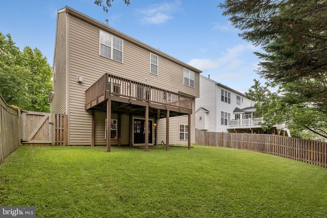 21411 Emerald Dr, Germantown, MD 20876 - back of property featuring a fenced backyard, a gate, and a deck