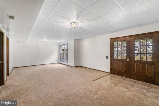 21411 Emerald Dr, Germantown, MD 20876 - entryway featuring carpet floors, a drop ceiling, and french doors