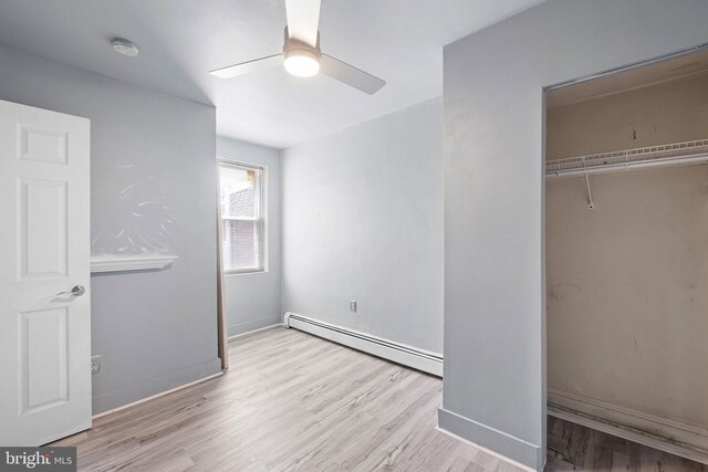 624 S Heald St, Wilmington, DE 19801 - unfurnished bedroom with baseboard heating, wood finished floors, a closet, and ceiling fan