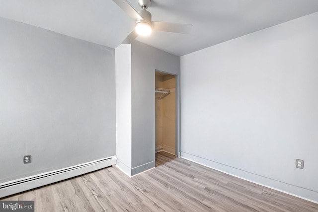 624 S Heald St, Wilmington, DE 19801 - unfurnished bedroom with a baseboard heating unit, wood finished floors, a closet, and ceiling fan