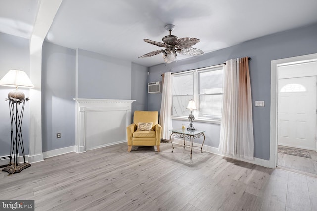 624 S Heald St, Wilmington, DE 19801 - living area featuring wood finished floors, a wall mounted AC, and a ceiling fan