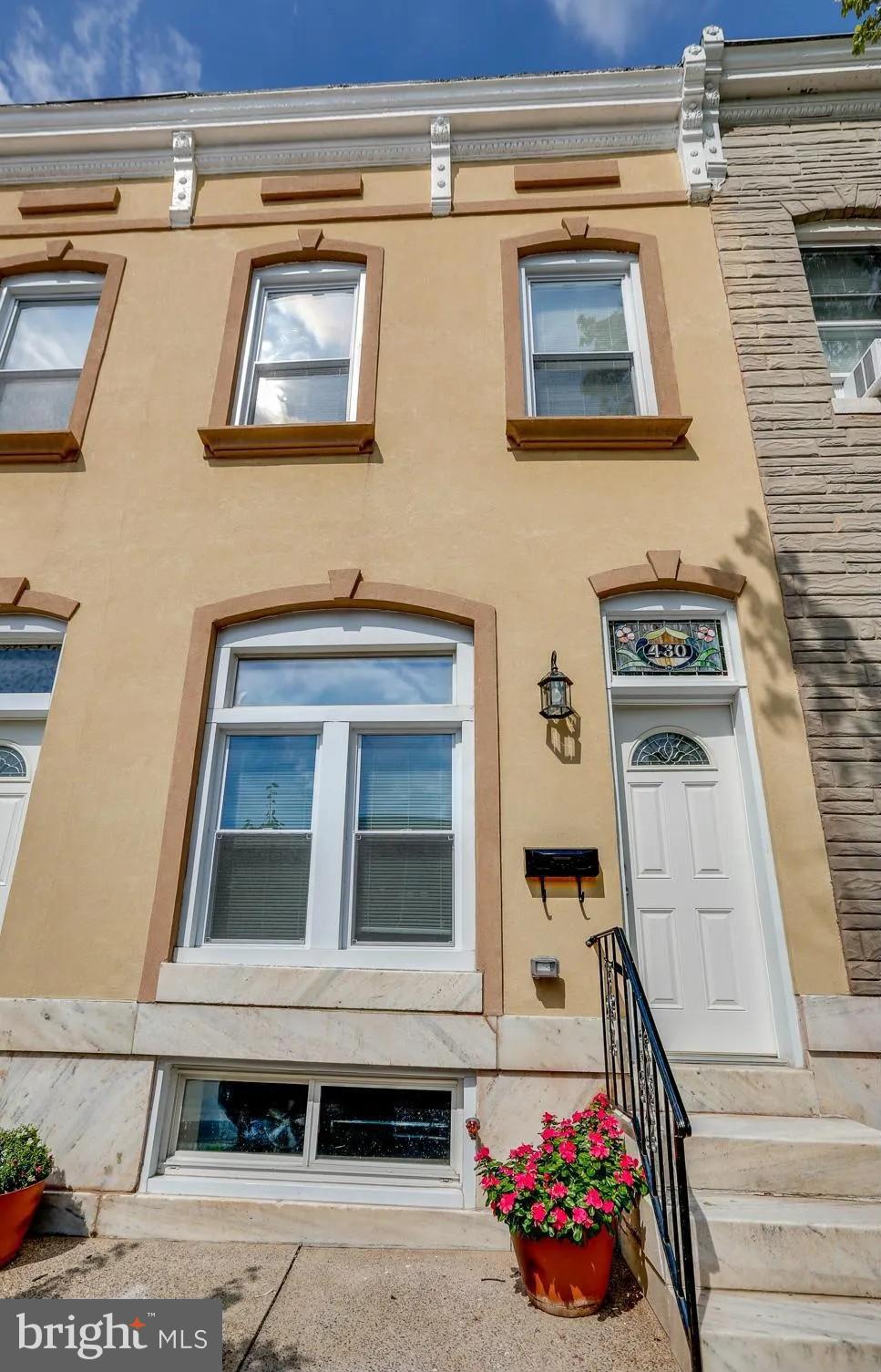 430 N Milton Ave, Baltimore, MD 21224 - view of front of house with stucco siding