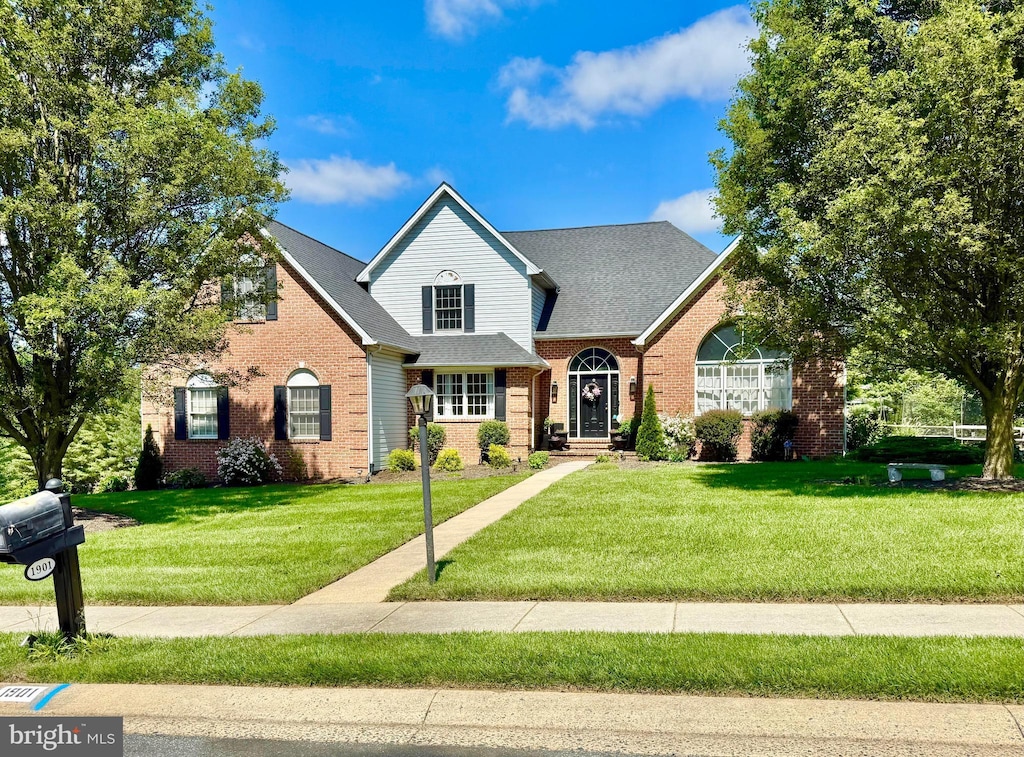 1901 Hamlet Pl N, Bel Air, MD 21015 - traditional-style house featuring brick siding, a front yard, and a shingled roof