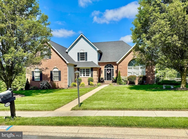 1901 Hamlet Pl N, Bel Air, MD 21015 - traditional-style house featuring brick siding, a front yard, and a shingled roof