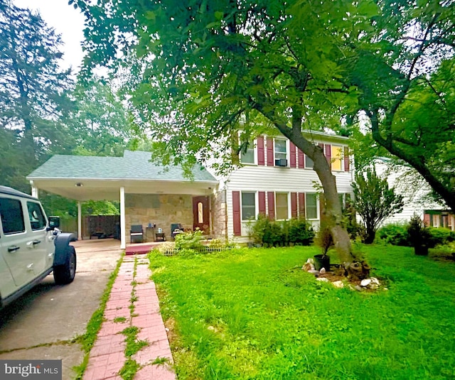 16820 Malabar St, Rockville, MD 20855 - view of front of house with driveway, stone siding, a front yard, and an attached carport