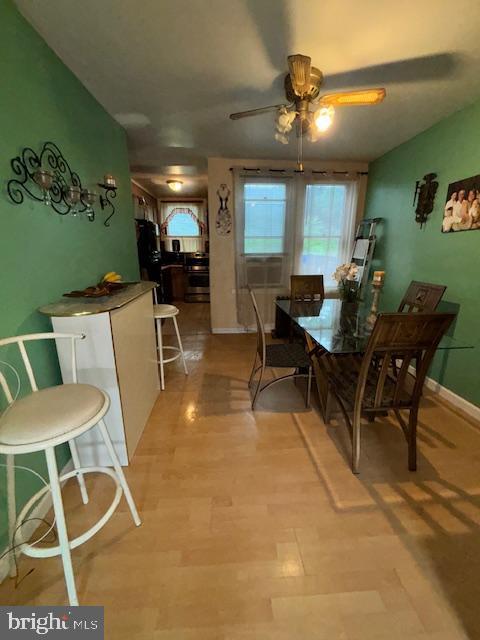 4546 N Palethorp St, Philadelphia, PA 19140 - dining room featuring a ceiling fan and light wood finished floors