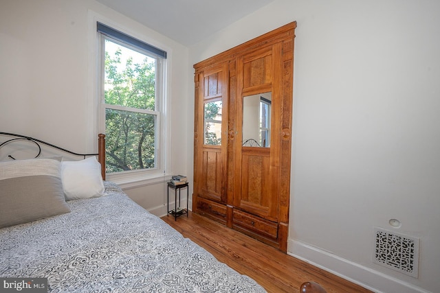 823 N 21st St, Philadelphia, PA 19130 - bedroom with multiple windows and wood finished floors