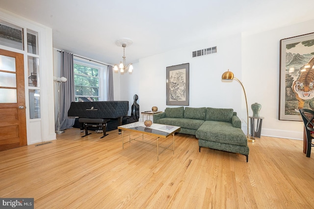 823 N 21st St, Philadelphia, PA 19130 - living room with a chandelier and wood finished floors