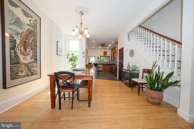 823 N 21st St, Philadelphia, PA 19130 - dining area with a chandelier, stairway, and light wood-style flooring