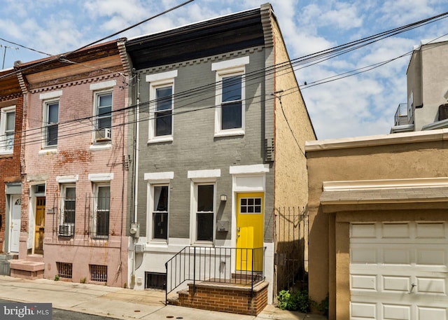1645 S Carlisle St, Philadelphia, PA 19145 - view of property featuring a garage and brick siding