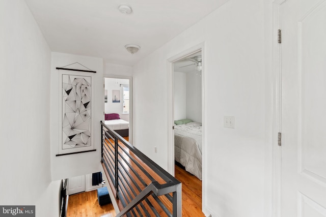 1645 S Carlisle St, Philadelphia, PA 19145 - hall featuring light wood-style floors and an upstairs landing
