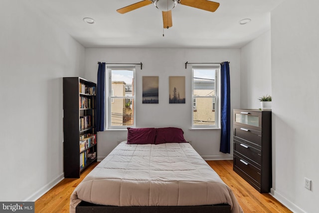 1645 S Carlisle St, Philadelphia, PA 19145 - bedroom with multiple windows, light wood-style floors, and ceiling fan