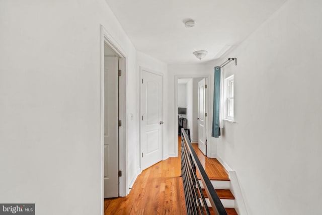 1645 S Carlisle St, Philadelphia, PA 19145 - hallway with an upstairs landing and light wood-style floors