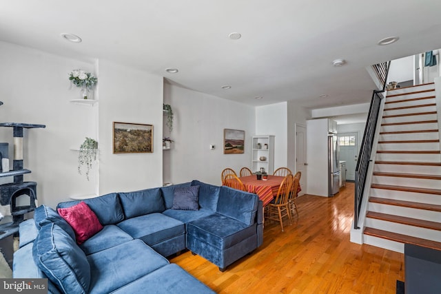 1645 S Carlisle St, Philadelphia, PA 19145 - living room featuring stairs, light wood-type flooring, and recessed lighting