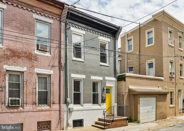 1645 S Carlisle St, Philadelphia, PA 19145 - townhome / multi-family property featuring brick siding and an attached garage