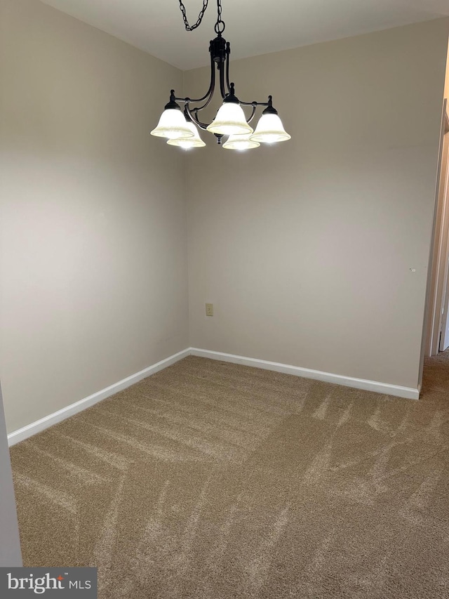 2204 Westcourt Ln Unit 313, Herndon, VA 20170 - empty room featuring carpet flooring and a chandelier