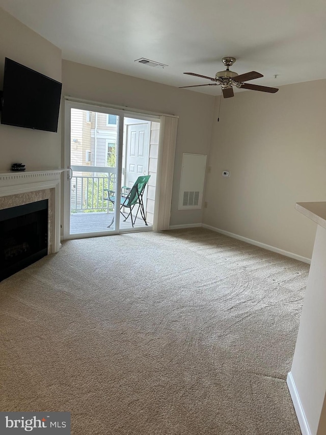 2204 Westcourt Ln Unit 313, Herndon, VA 20170 - unfurnished living room with carpet, a ceiling fan, and a premium fireplace