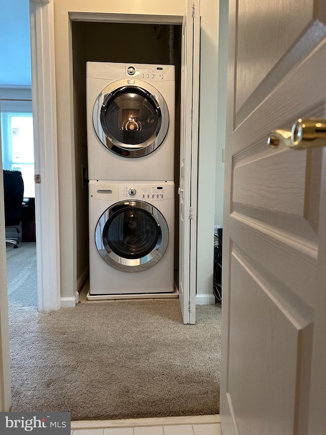 2204 Westcourt Ln Unit 313, Herndon, VA 20170 - laundry area featuring stacked washing machine and dryer and carpet flooring