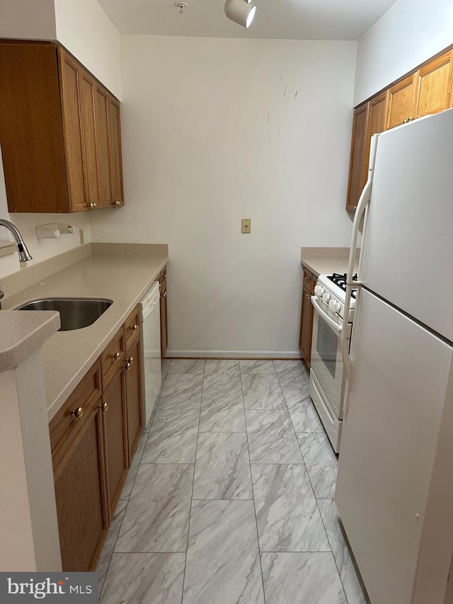 2204 Westcourt Ln Unit 313, Herndon, VA 20170 - kitchen featuring white appliances, light marble finish floors, brown cabinetry, and light countertops