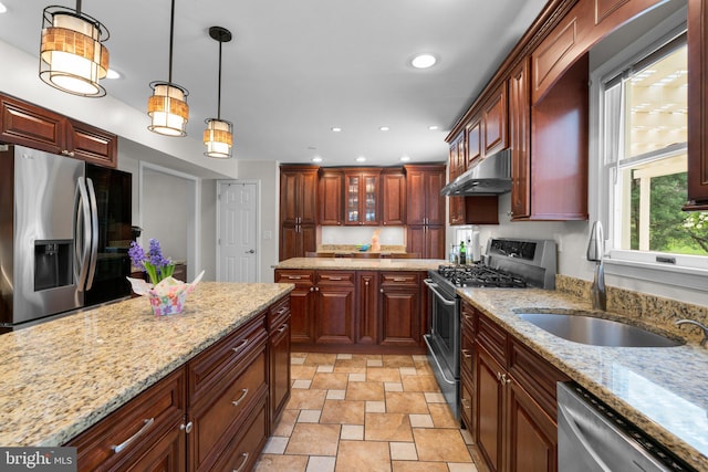 6212 Monroe Ave, Sykesville, MD 21784 - kitchen featuring appliances with stainless steel finishes, under cabinet range hood, recessed lighting, stone finish floors, and pendant lighting