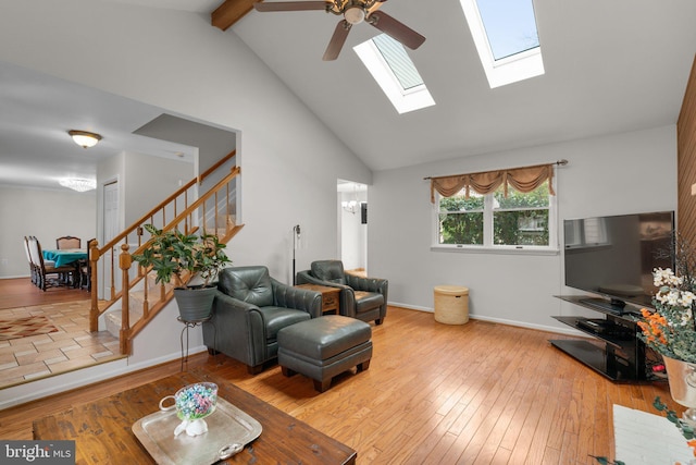 6212 Monroe Ave, Sykesville, MD 21784 - living room featuring stairway, hardwood / wood-style floors, ceiling fan, a skylight, and beamed ceiling