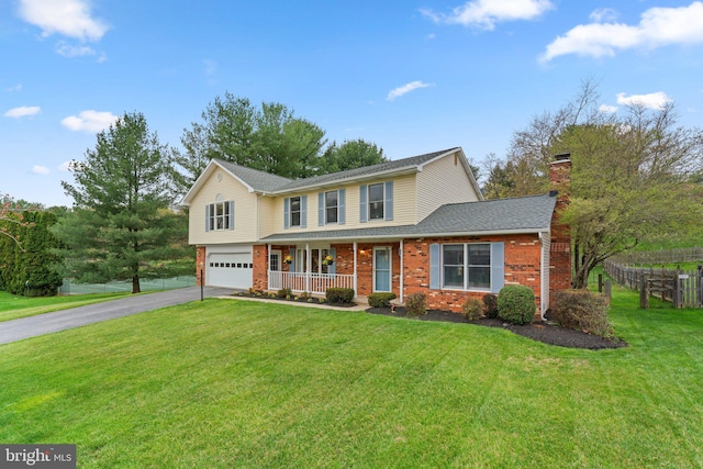 6212 Monroe Ave, Sykesville, MD 21784 - traditional home with covered porch, driveway, a garage, a chimney, and brick siding