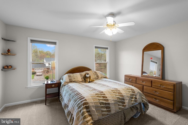 6212 Monroe Ave, Sykesville, MD 21784 - carpeted bedroom featuring multiple windows and ceiling fan