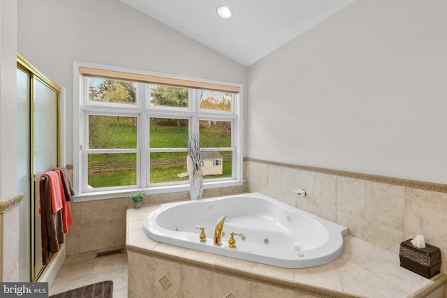 6212 Monroe Ave, Sykesville, MD 21784 - bathroom with a tub with jets, a shower stall, vaulted ceiling, and tile patterned floors