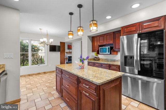 6212 Monroe Ave, Sykesville, MD 21784 - kitchen featuring stainless steel appliances, pendant lighting, a center island, light stone counters, and a chandelier
