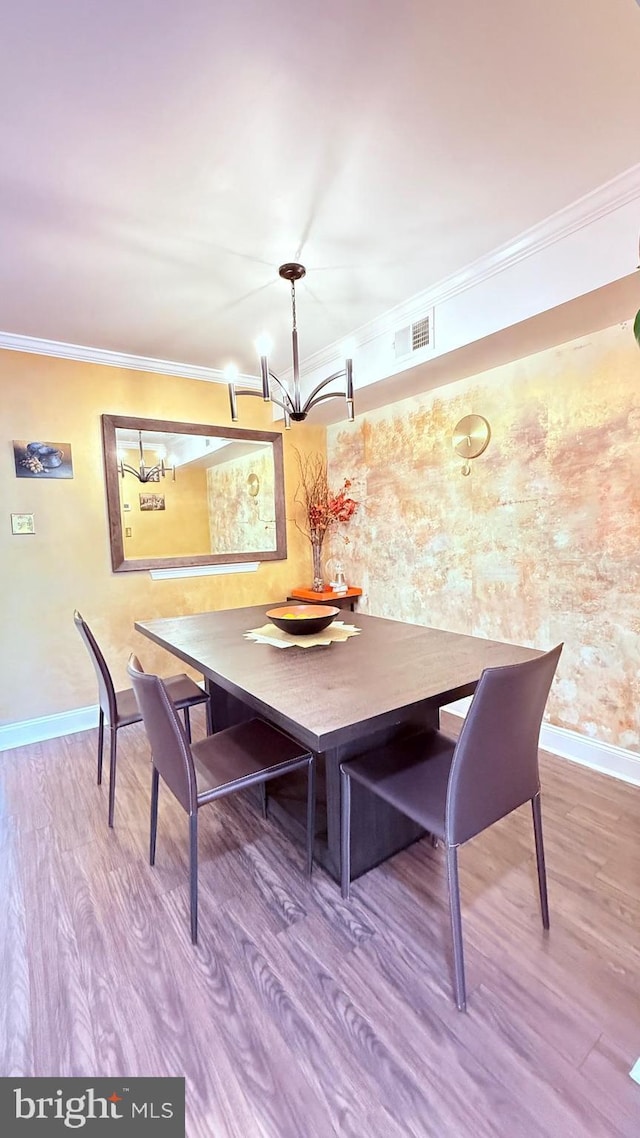 11881 Academy Rd Unit I6, Philadelphia, PA 19154 - dining area featuring a chandelier, crown molding, and wood finished floors