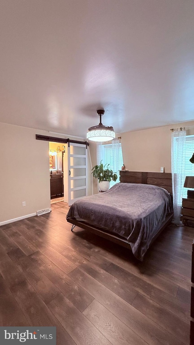 11881 Academy Rd Unit I6, Philadelphia, PA 19154 - bedroom with a barn door and wood finished floors