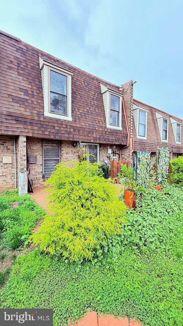 11881 Academy Rd Unit I6, Philadelphia, PA 19154 - view of front of house featuring brick siding and mansard roof