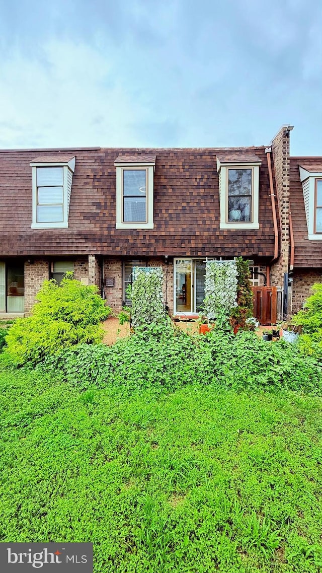 11881 Academy Rd Unit I6, Philadelphia, PA 19154 - view of front of home featuring mansard roof, brick siding, and roof with shingles