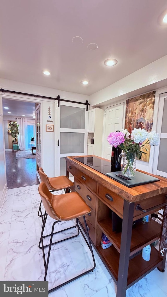 11881 Academy Rd Unit I6, Philadelphia, PA 19154 - dining area with light marble finish floors, a barn door, and recessed lighting