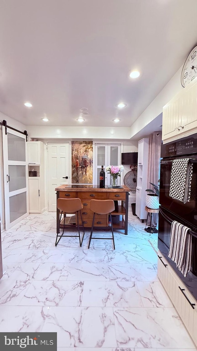 11881 Academy Rd Unit I6, Philadelphia, PA 19154 - interior space featuring a barn door, light marble finish floors, and recessed lighting