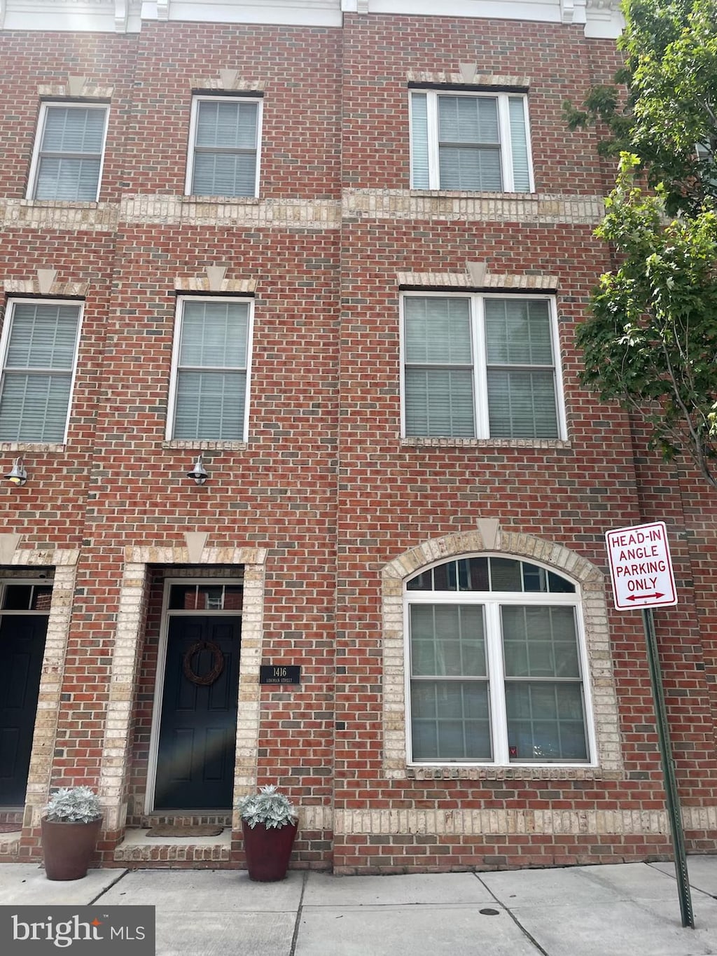 1416 Lowman St, Baltimore, MD 21230 - view of front of house featuring brick siding