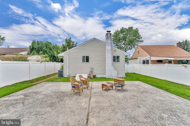 600 Central Ave, Runnemede, NJ 08078 - rear view of house with a patio area, a fire pit, a chimney, and a fenced backyard