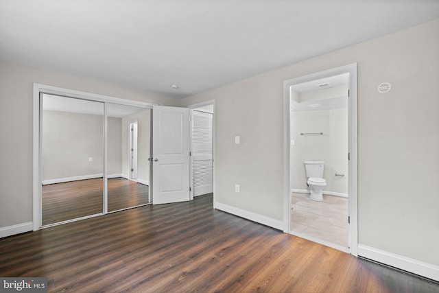 5908 Michael Rd, Waldorf, MD 20601 - unfurnished bedroom featuring a closet, wood finished floors, and connected bathroom