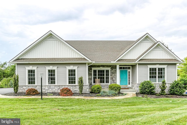 17 Beckleys Cor, Lebanon, PA 17042 - view of front of home with board and batten siding, stone siding, and a front yard